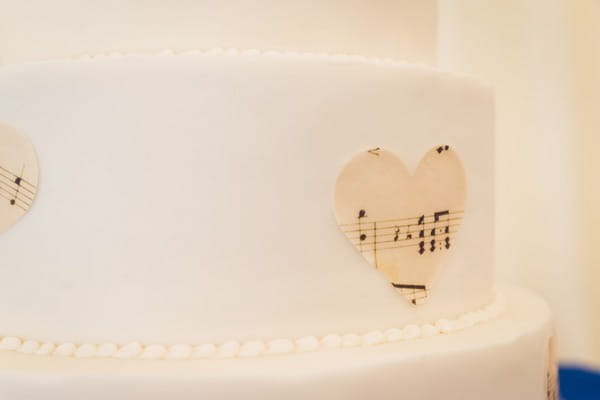 Sheet music heart on side of wedding cake