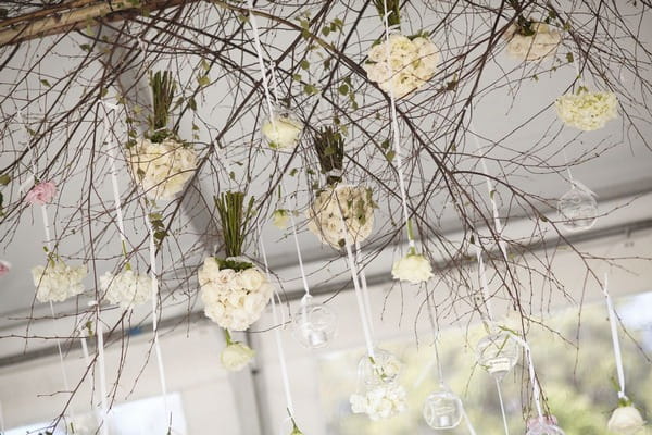 Flowers hanging from marquee ceiling