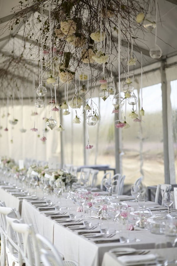 Marquee with flowers hanging from ceiling