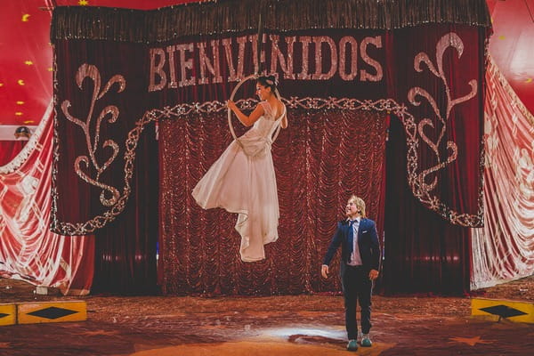 Bride and groom circus trapeze act