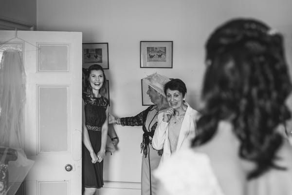 Woman seeing bride in wedding dress for the first time