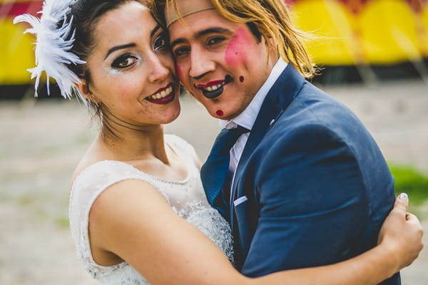 Bride with groom who has clown face