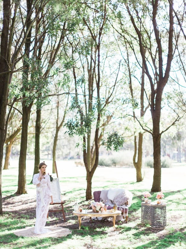 Bohemian bride in woodland wedding setup