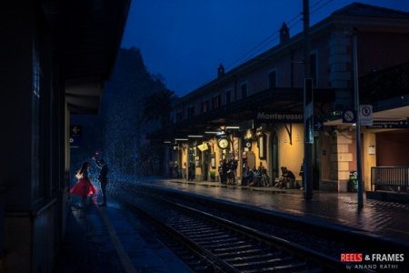 Bride and groom on train platform at night in the rain - Picture by Reels and Frames
