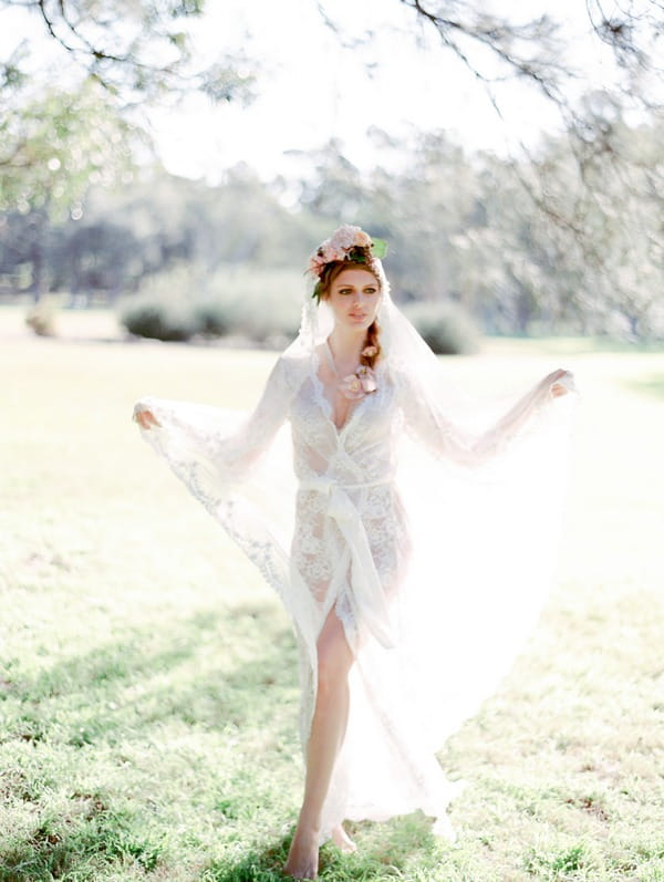 Bohemian bride wearing see through lace wedding robe