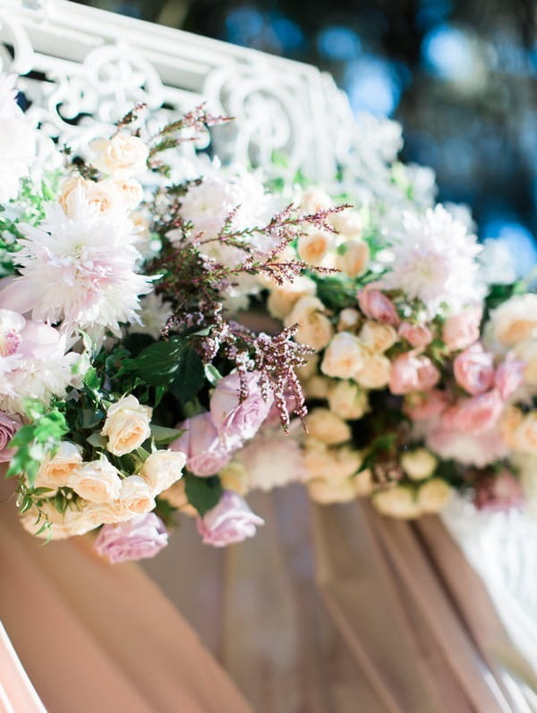 Flowers across top of ceremony structure