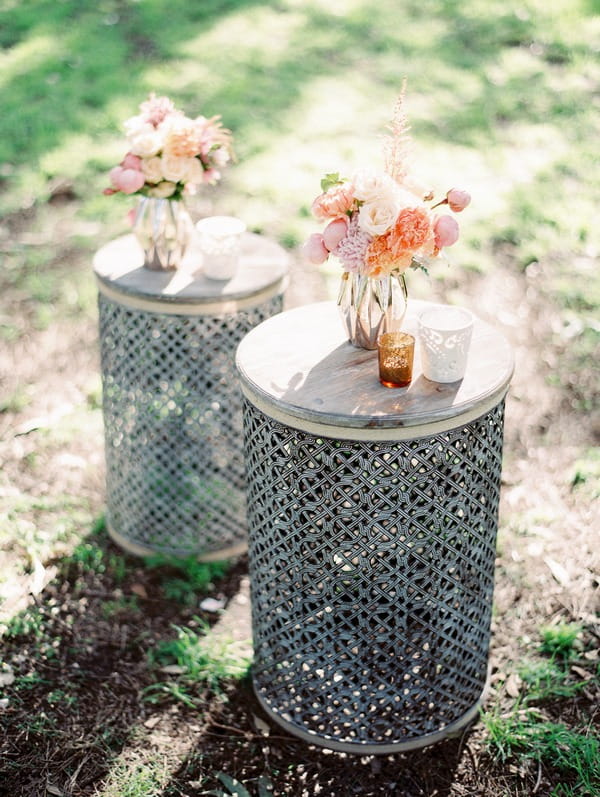 Vases of flowers on rustic tables