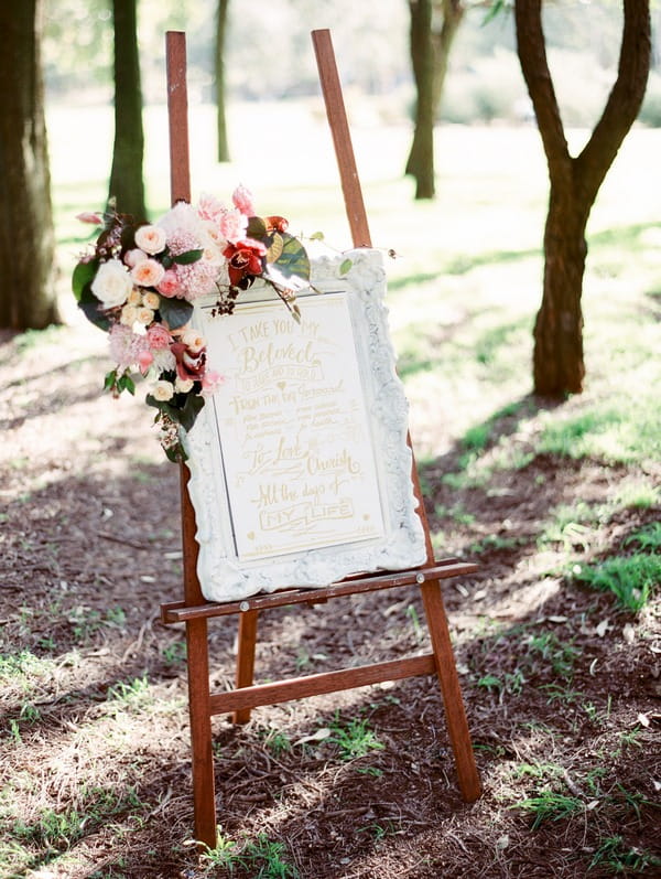 Wedding sign in frame with flowers