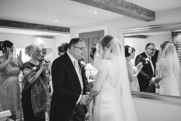 Father seeing bride for first time on wedding day