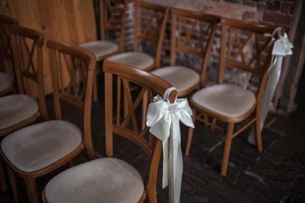 Ribbon bow tied to ceremony chair