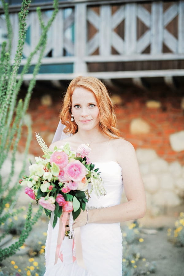 Katie Leclerc holding wedding bouquet