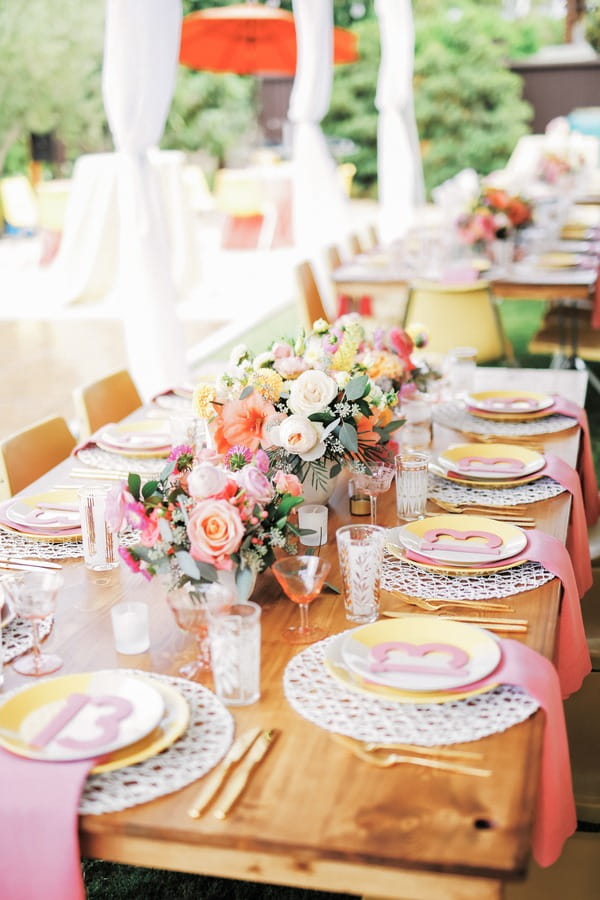 Long wedding table with colourful styling