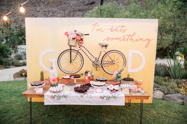 Wedding cake table with bicycle backdrop