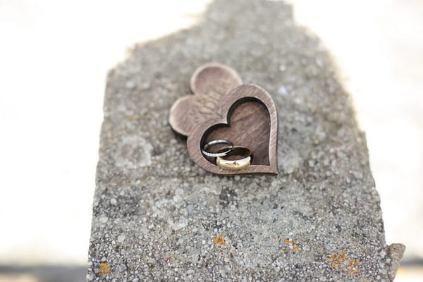 Wedding rings in wooden heart