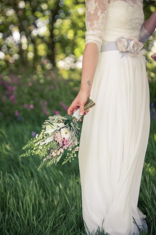 Bride holding rustic bouquet