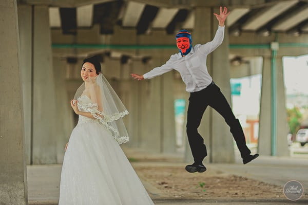 Groom with devil balaclava jumping out on bride