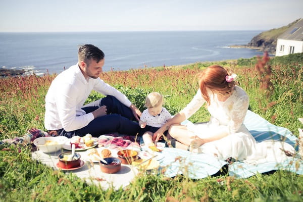 Bride and groom having picnic after BoHo Cornwall elopement