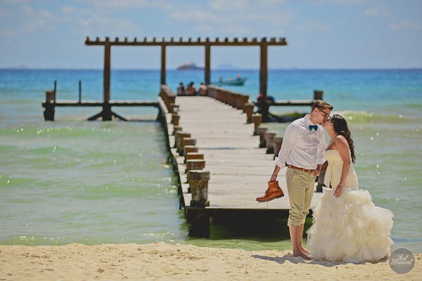 Bride and groom on beach in Mexico