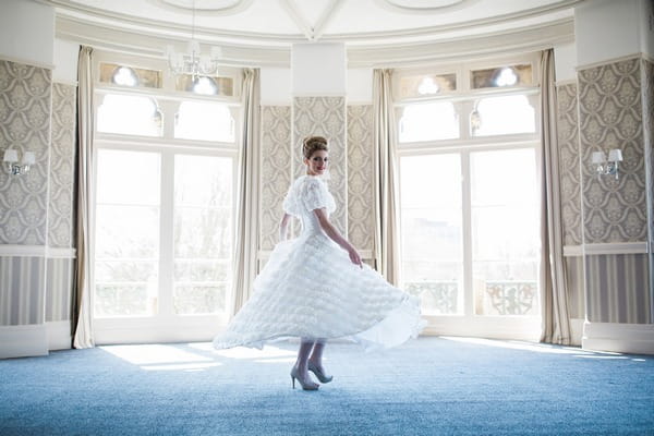 Bride twirling in The Duke of Cornwall Hotel