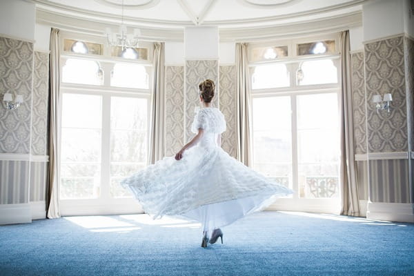 Bride twirling in The Duke of Cornwall Hotel