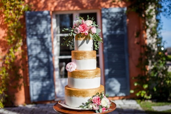 Gold and white stripe wedding cake