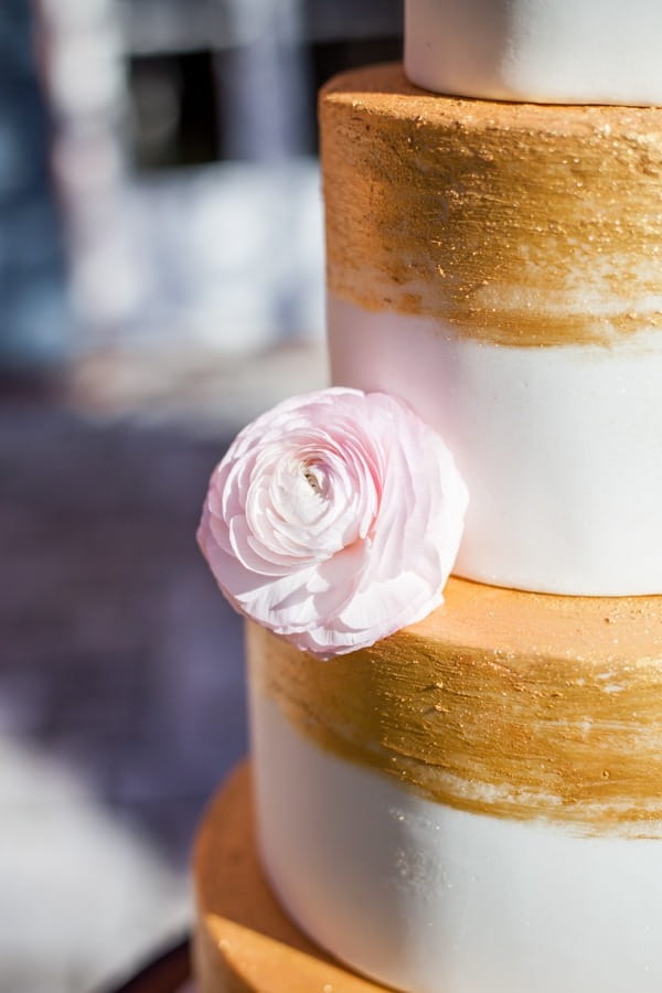 Flower on side of wedding cake