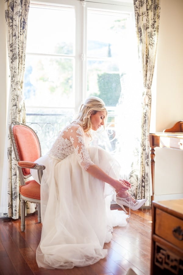 Bride putting on shoe