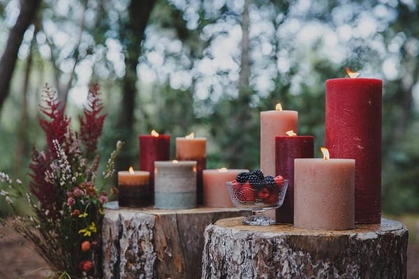 Candles on tree stumps