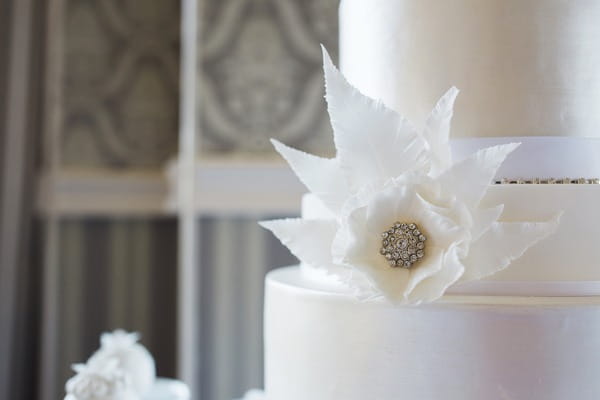 Floral brooch detail on wedding cake