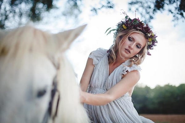 Boho bride riding horse