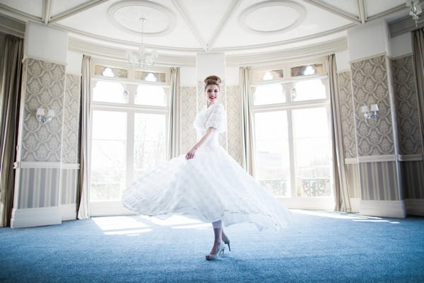 Bride twirling in The Hayward Room in The Duke of Cornwall Hotel