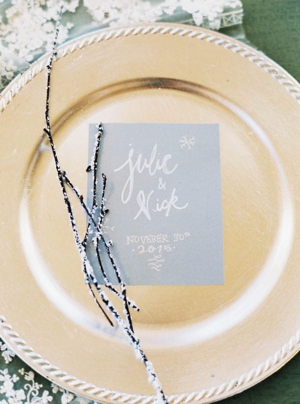 Blue winter wedding invitation on plate