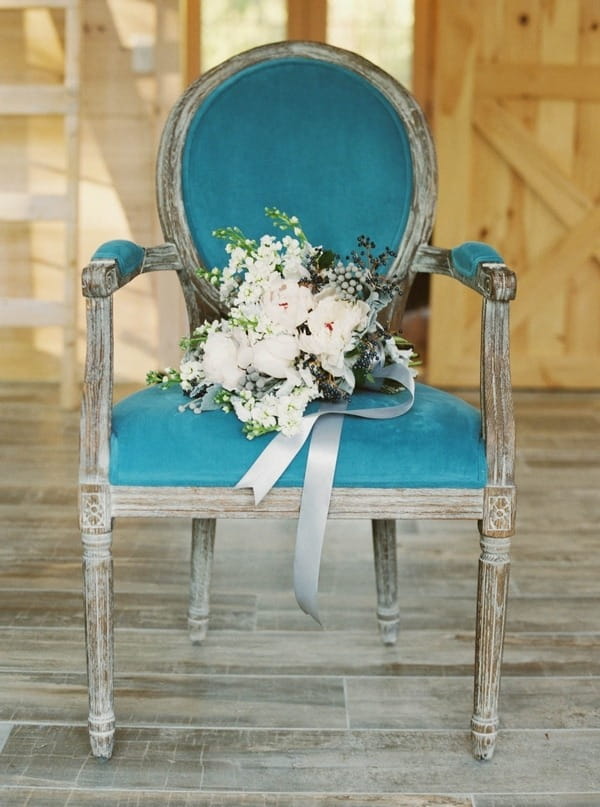 Wedding bouquet on blue chair