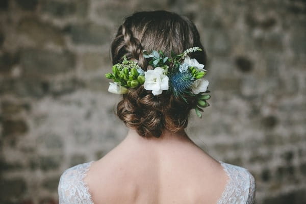 Bride's updo with hair flowers