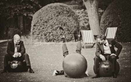 Groomsman falling off space hopper - Picture by Martins Kikulis Wedding Photography