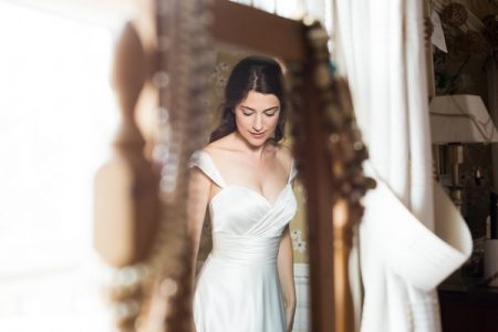 Reflection of bride in mirror - Picture by Fiona Kelly Wedding Photography