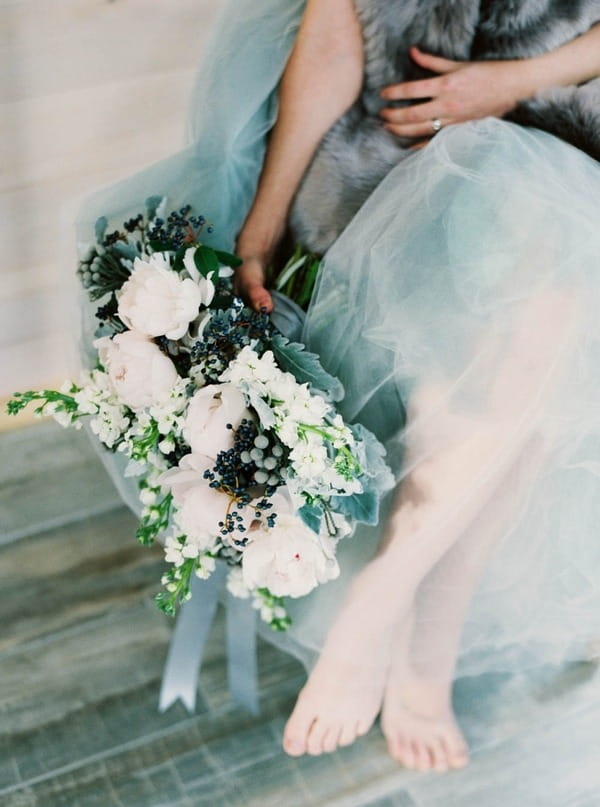 Bride holding winter wedding bouquet