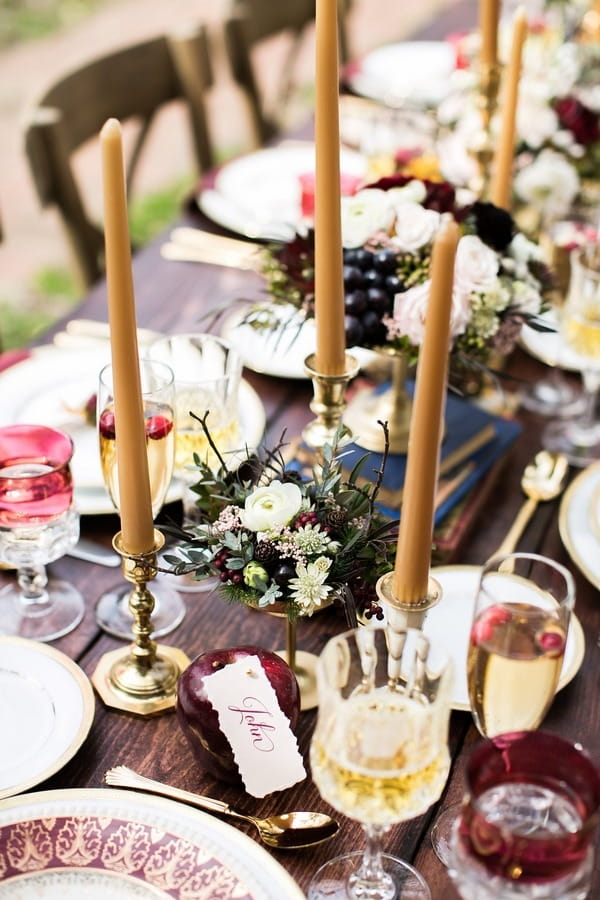 Gold candles on wedding table