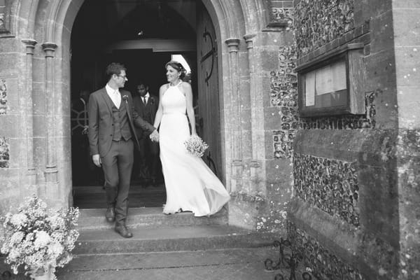 Bride and groom at door of church