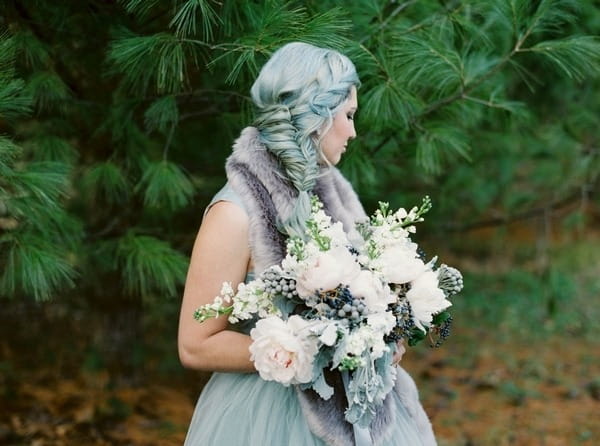 Bride with blue hair looking away