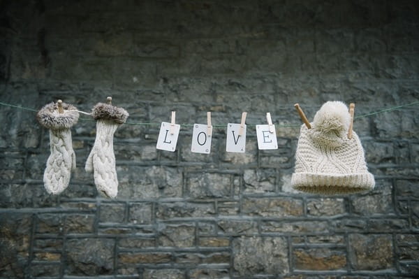 Hat, gloves and LOVE cards pegged to clothes line