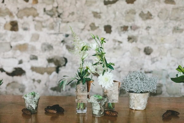 Pots and votives with winter foliage