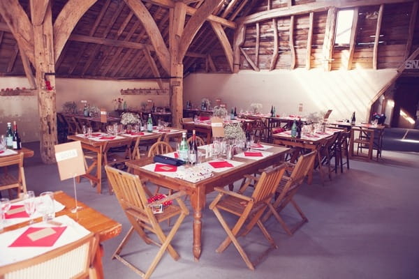 Wedding tables in barn at West Stoke Farm wedding