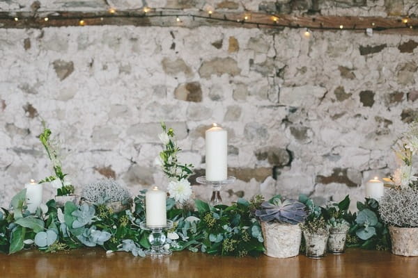 Foliage and candles on wedding table