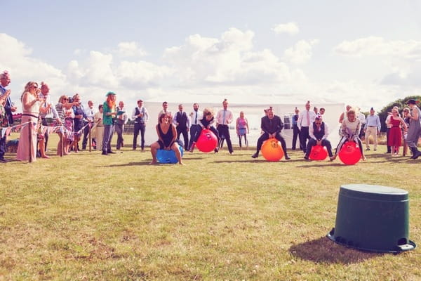 Space hopper race at West Stoke Farm wedding