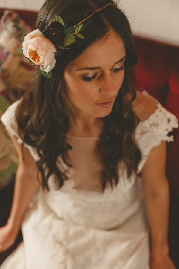 Bride sitting wearing floral headband