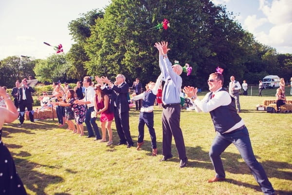 Bouquet catching game at West Stoke Farm wedding