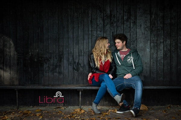 Couple sitting in wooden shelter