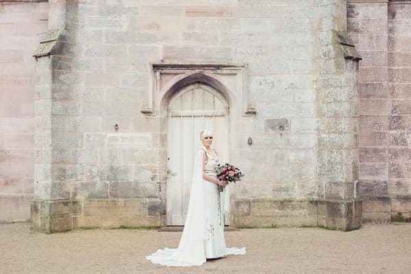 Bride standing outside Lowther Castle