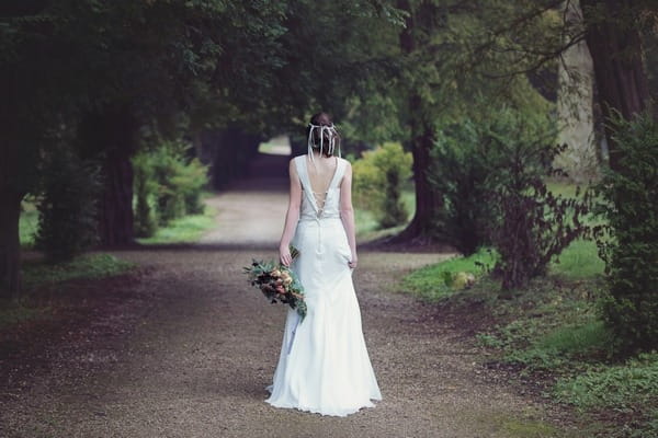 Back of bride standing on lane